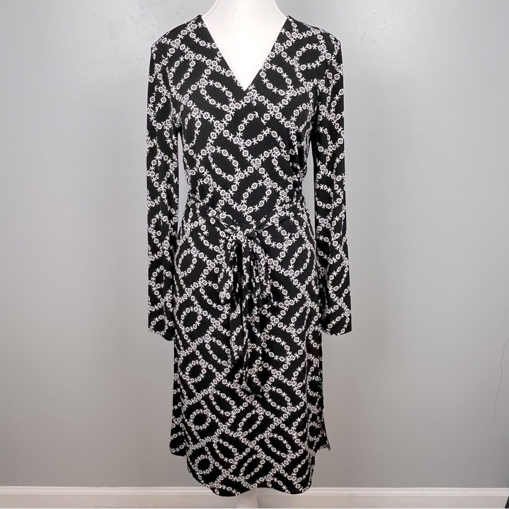 Loft black ditzy floral pattern true wrap long sleeve dress, size medium.